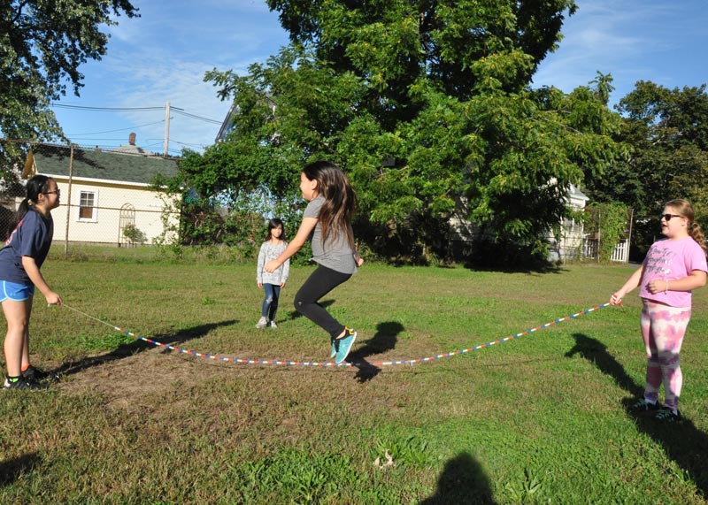 girls jumping rope outside at Atlantic Afterschool Program