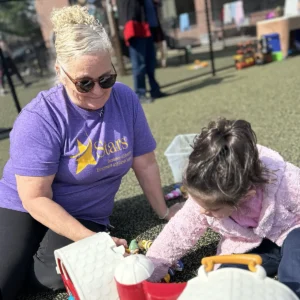 Teacher playing with student on playground